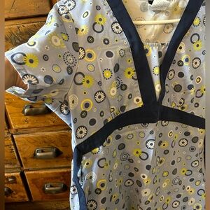Colorful scrubs for work able to be cinched size small from the brand Cherokee!
